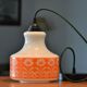 Seventies chandelier in white opaline decorating orange flowers