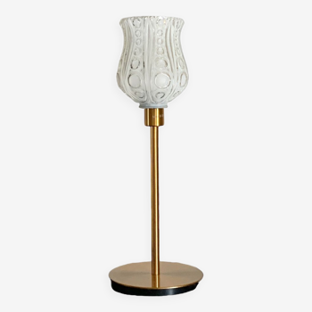 Table lamp with a white tulip lampshade and a gold base