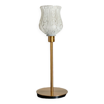 Table lamp with a white tulip lampshade and a gold base