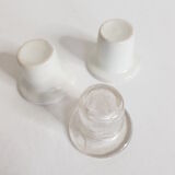 Three white porcelain and glass inkwells for school desk