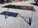 Bureau piètement chromé dessus en verre teinté 140/60cms