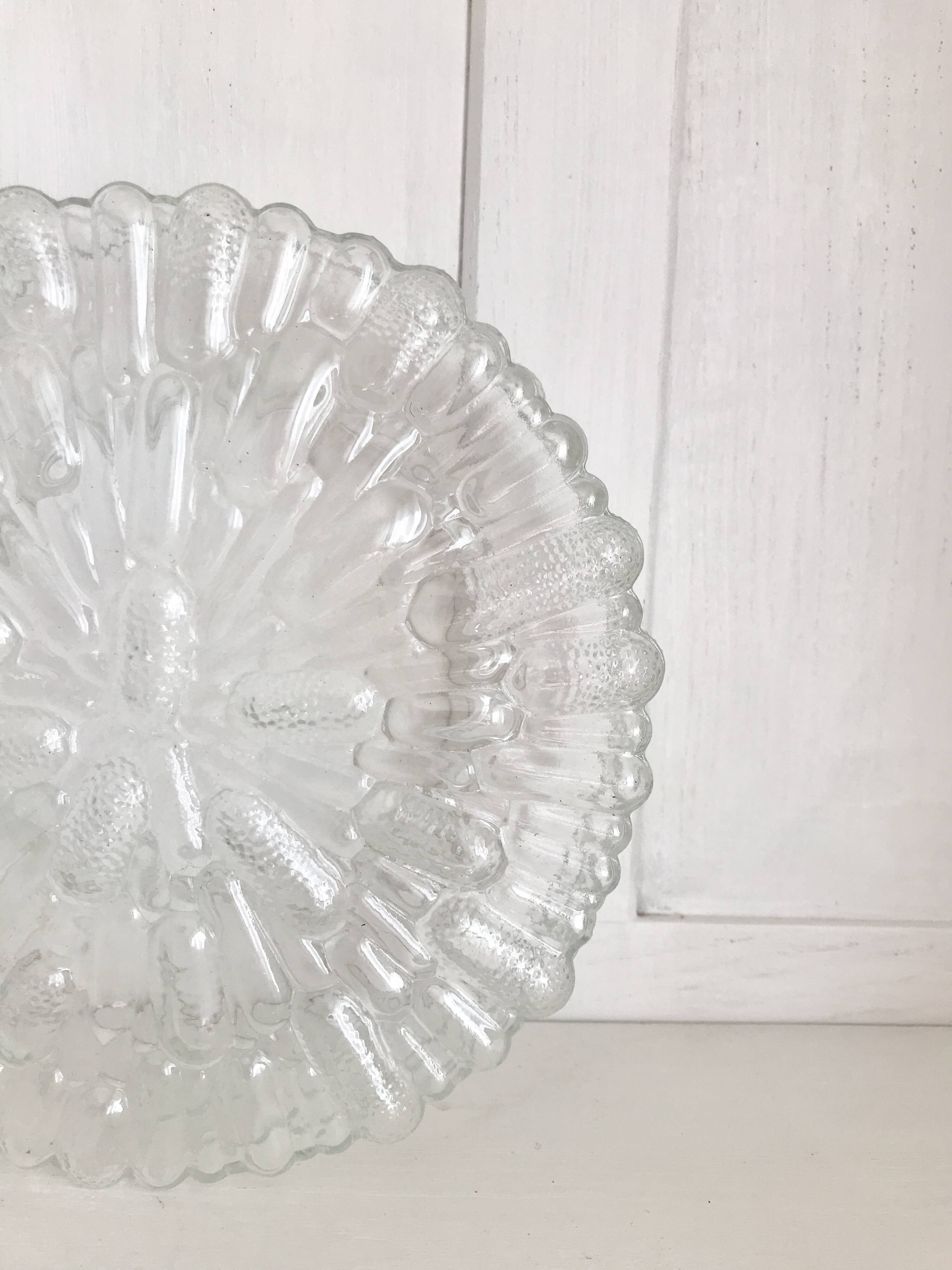 Two round molded glass ceiling lights