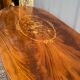 Louis XVI style oval dining table with rosewood marquetry extension mounted in bronze