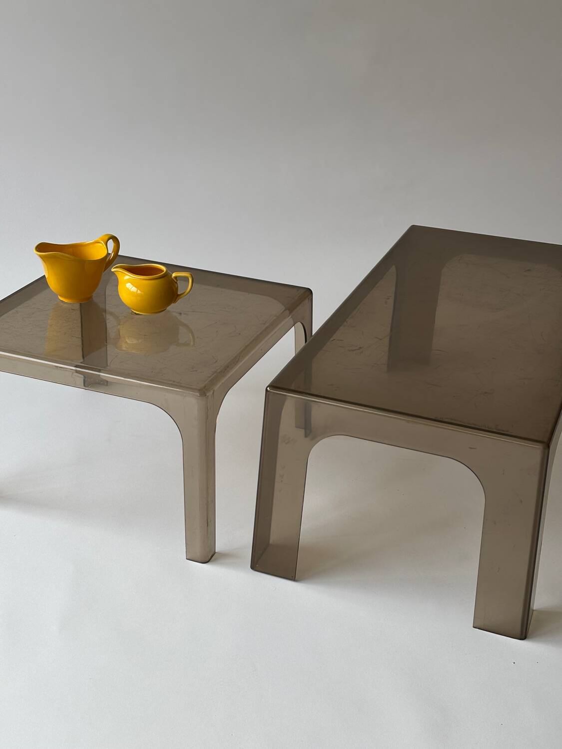 Smoked plastic coffee tables 1970