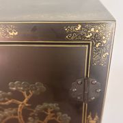 Magnificent black and gold lacquered Chinese cabinet.