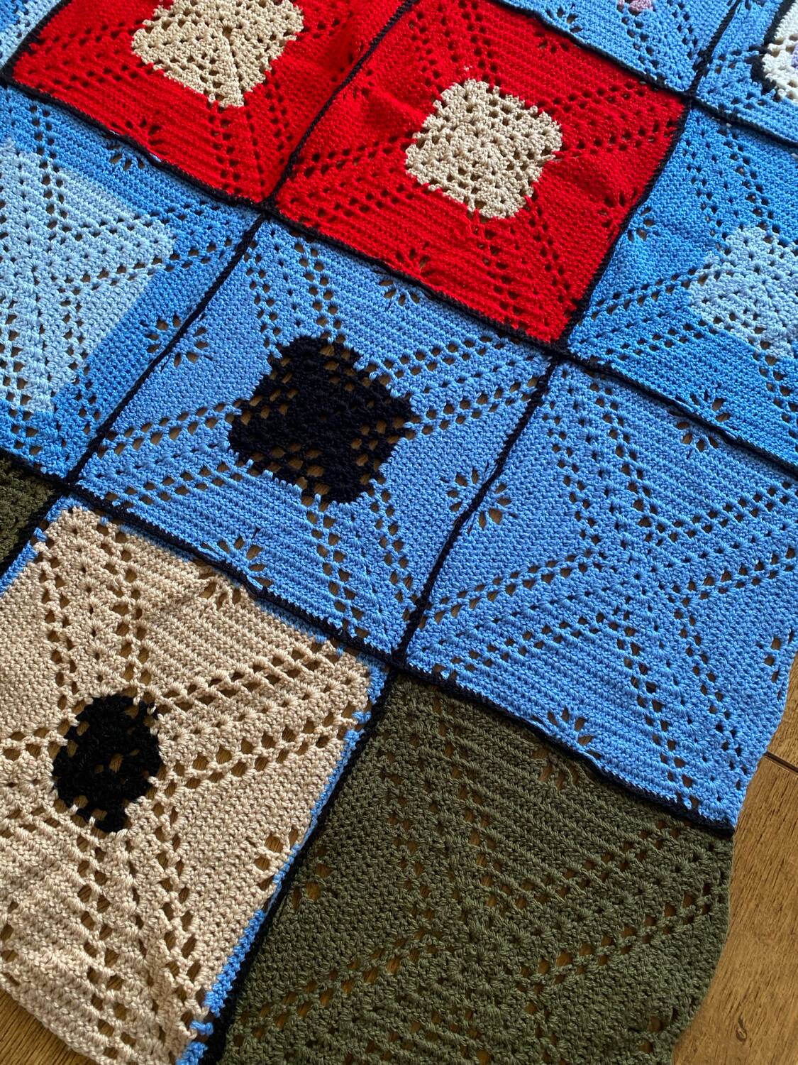 Hand-knitted patchwork blanket