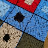Hand-knitted patchwork blanket
