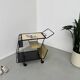 Perforated metal serving trolley in the Mathieu Matégot style