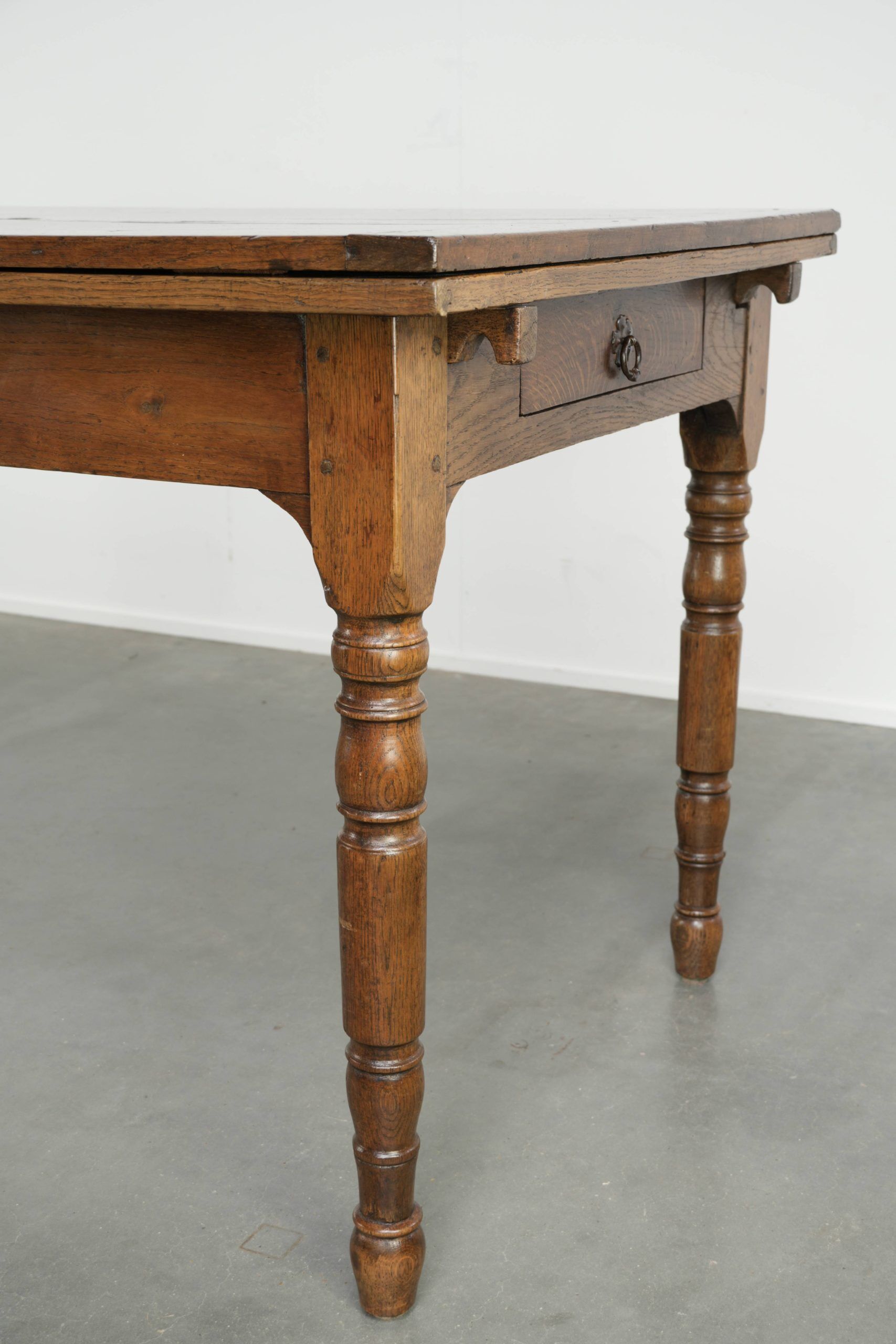 Antique oak dining table from the late 18th century with extendable leaves