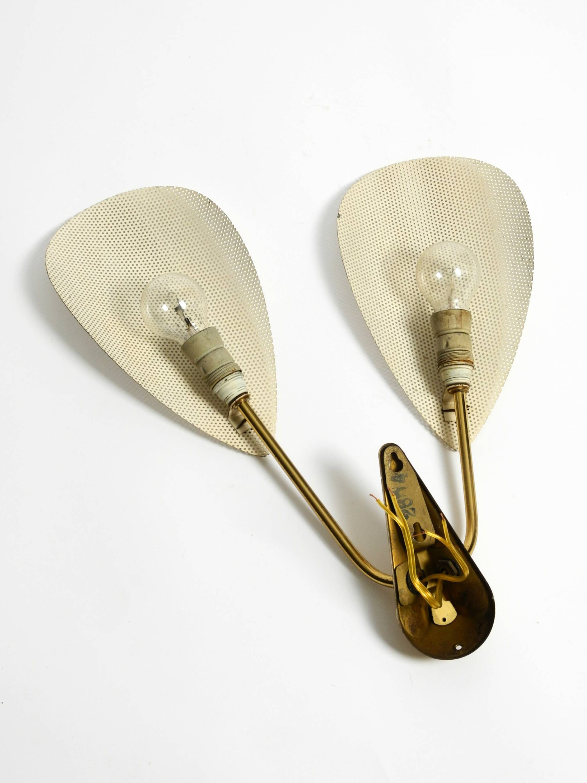 Mid Century Modern brass wall lamp with perforated metal sheet lampshades