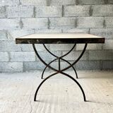 Table made of wrought iron and cement