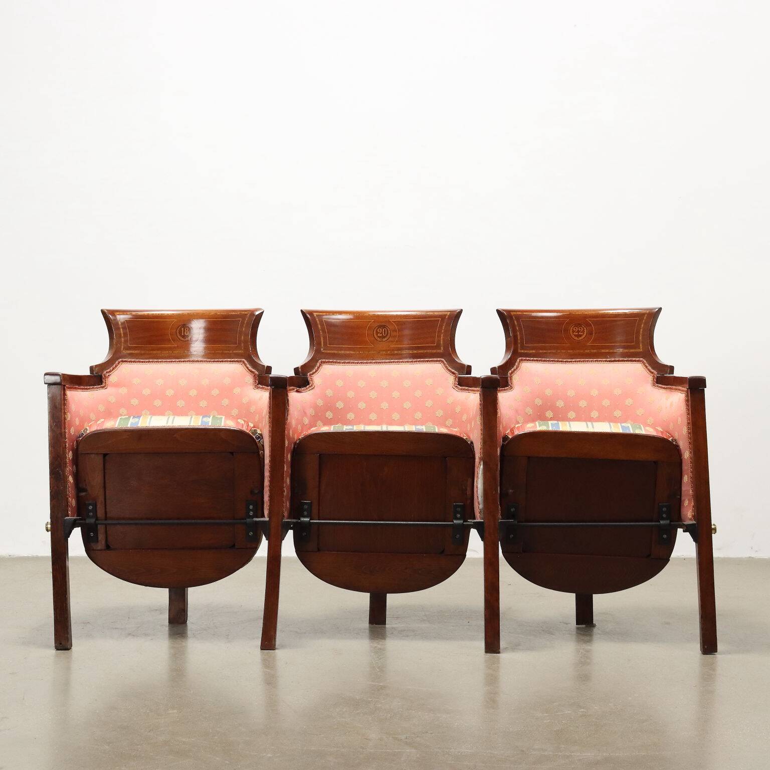 Three vintage cinema or theatre armchairs