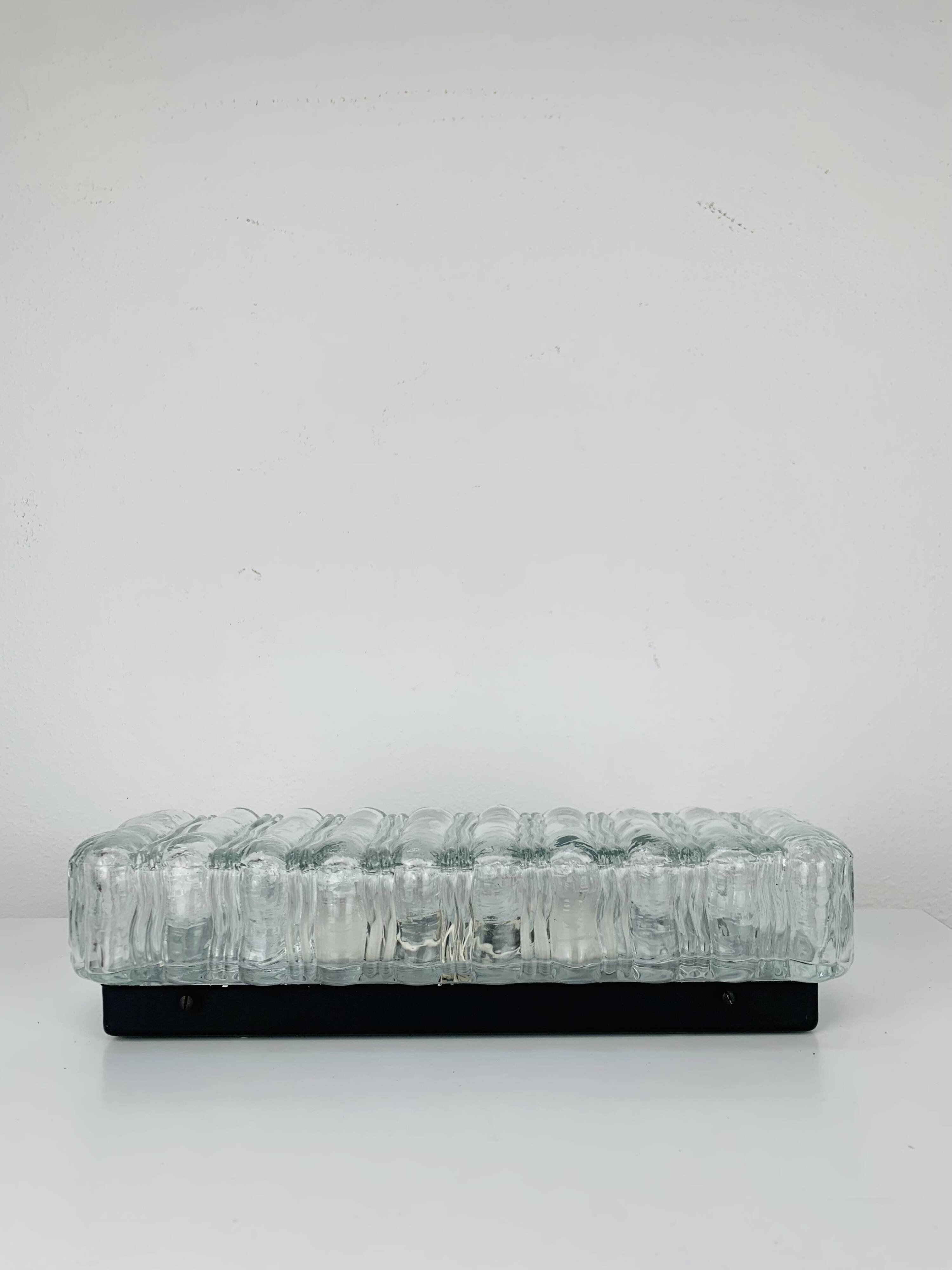 Rectangular wall lamp in molded glass and black metal from the 60s