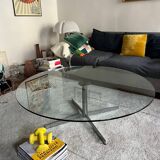 Glass coffee table with chrome base in the style of Roche Bobois