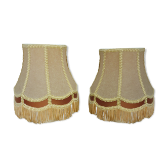 Pair of beige lampshades in vellum with trimmings and fringes