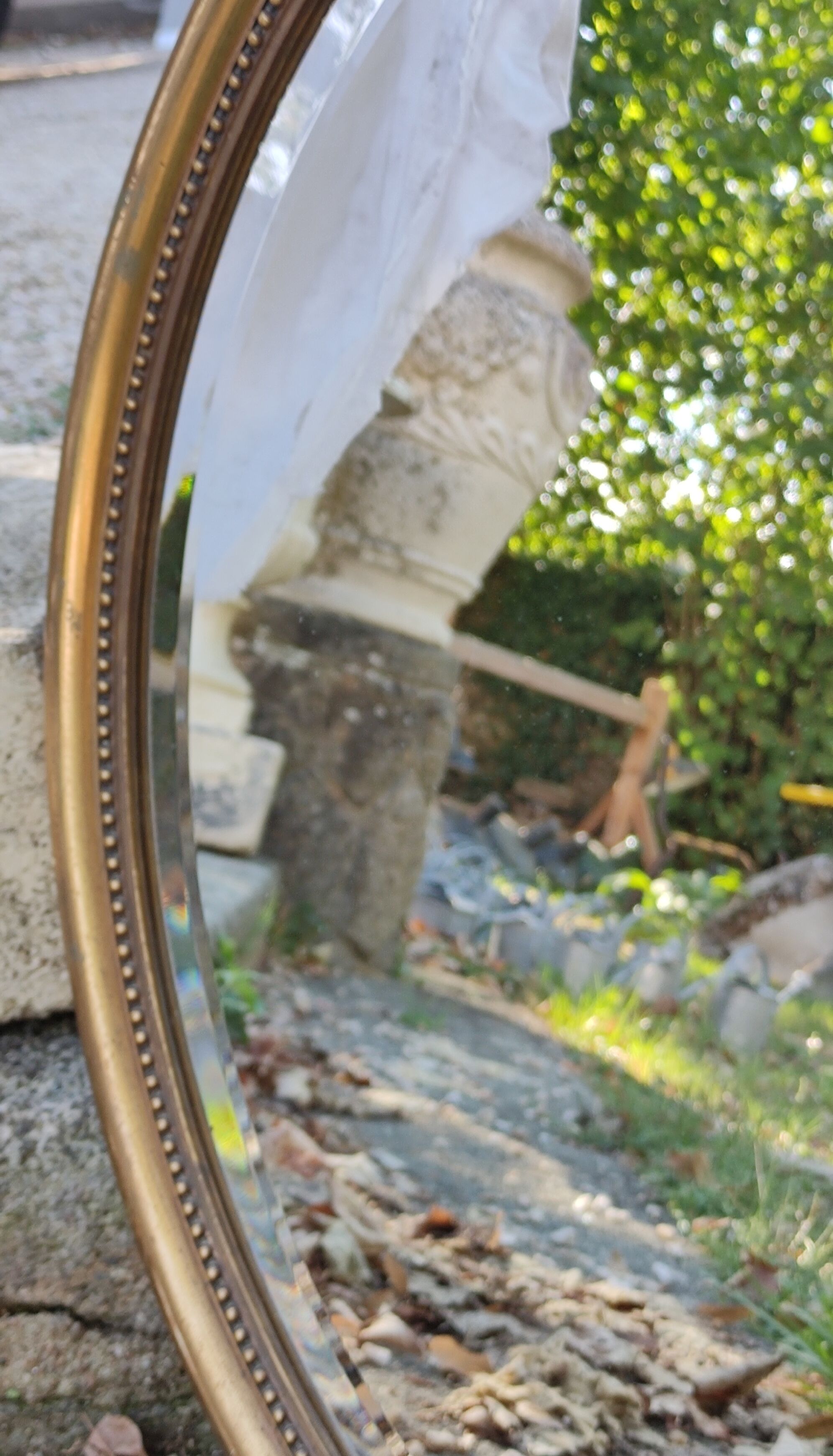 Old beveled round mirror
