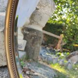 Old beveled round mirror