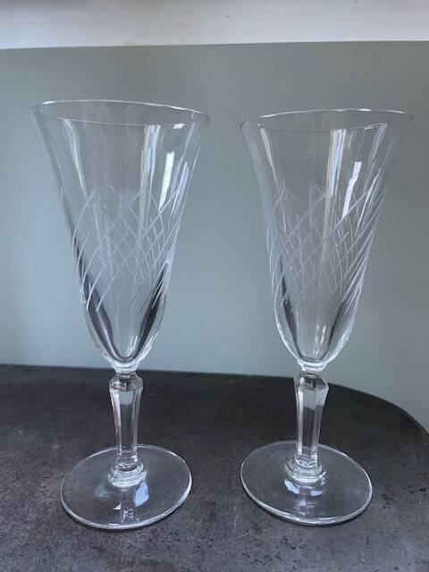 2 antique blown glass champagne flutes, tulip shape.
