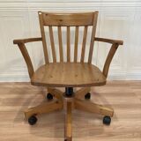 Solid wood swivel and reclining armchair.