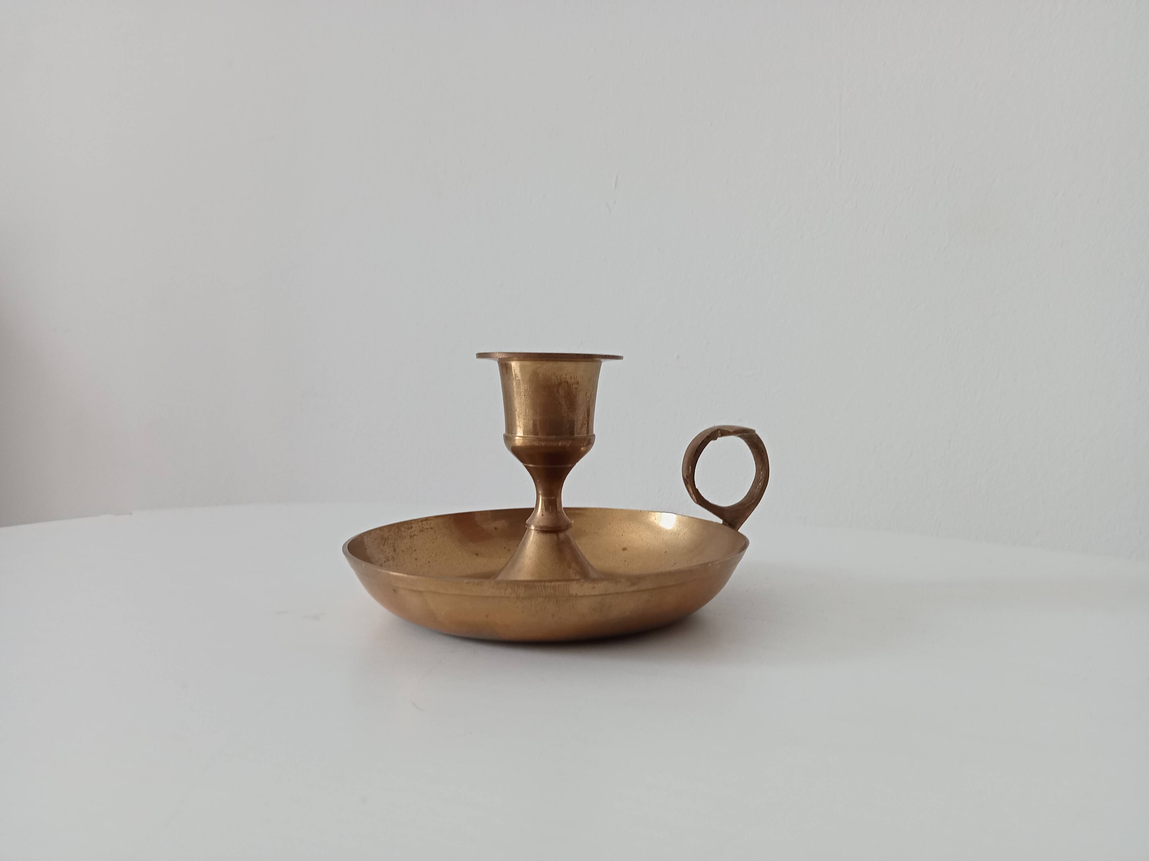 Vintage golden brass hand candle holder