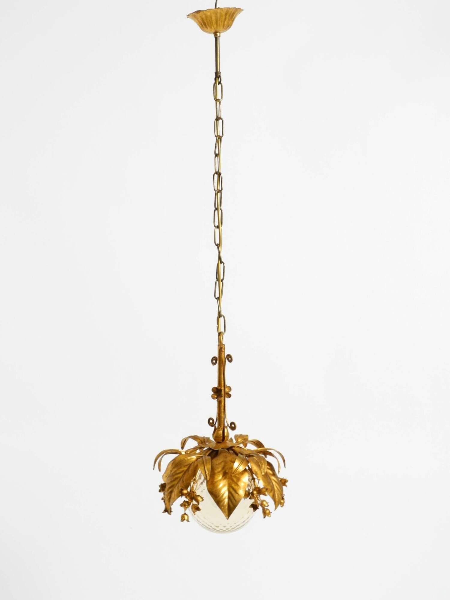 1970s gold-plated metal pendant lamp with a glass sphere by Hans Kögl