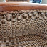 Armchair in woven rattan and exotic wood