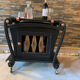 Renovated vintage bar cart in black and copper with removable serving tray.