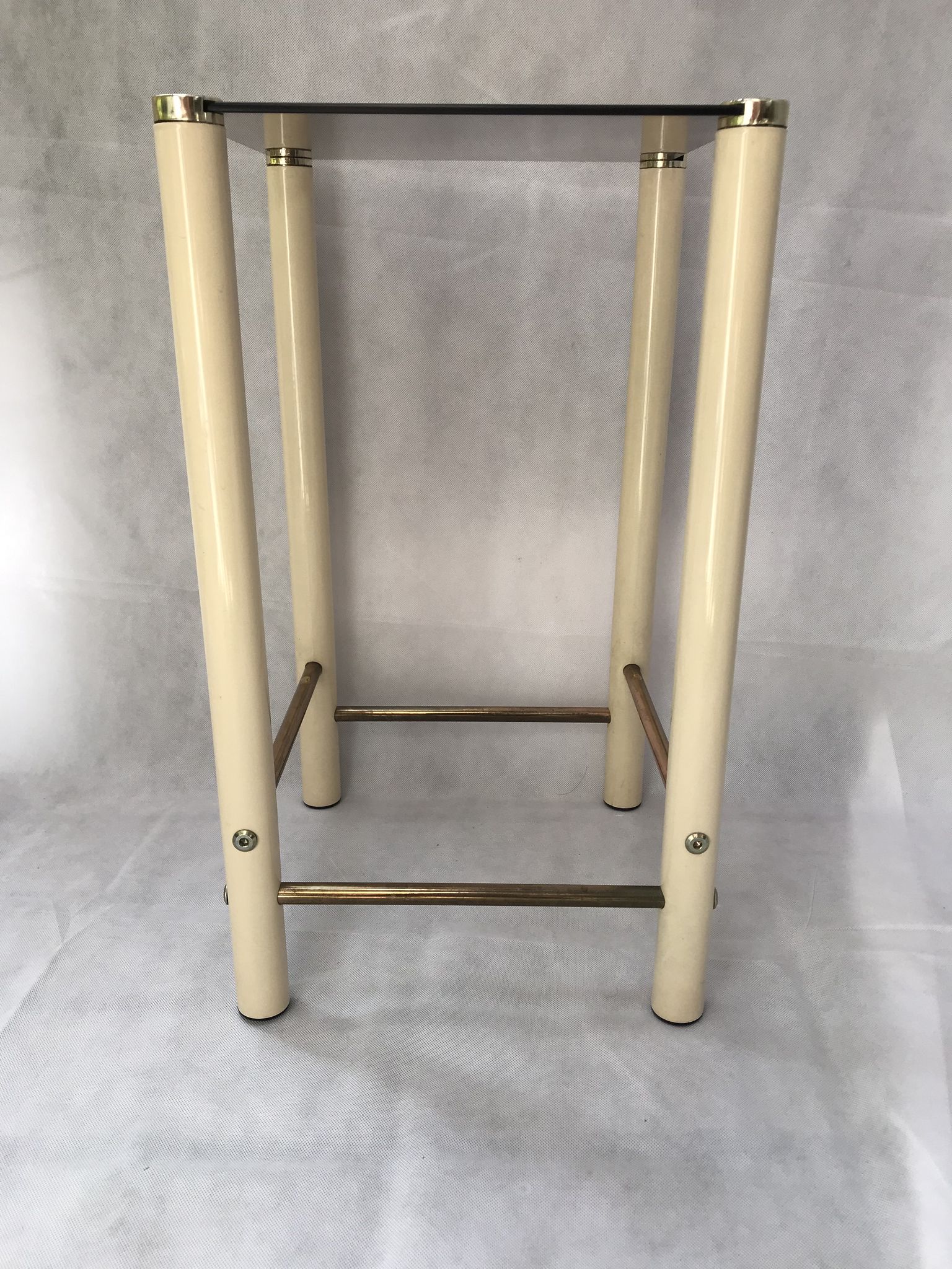Square side table in metal and smoked glass.