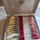 12 silver-plated metal teaspoons with a hallmark of 18.