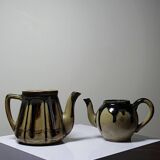 A pair of small vintage teapots in the Art Deco style reminiscent of Denbac.