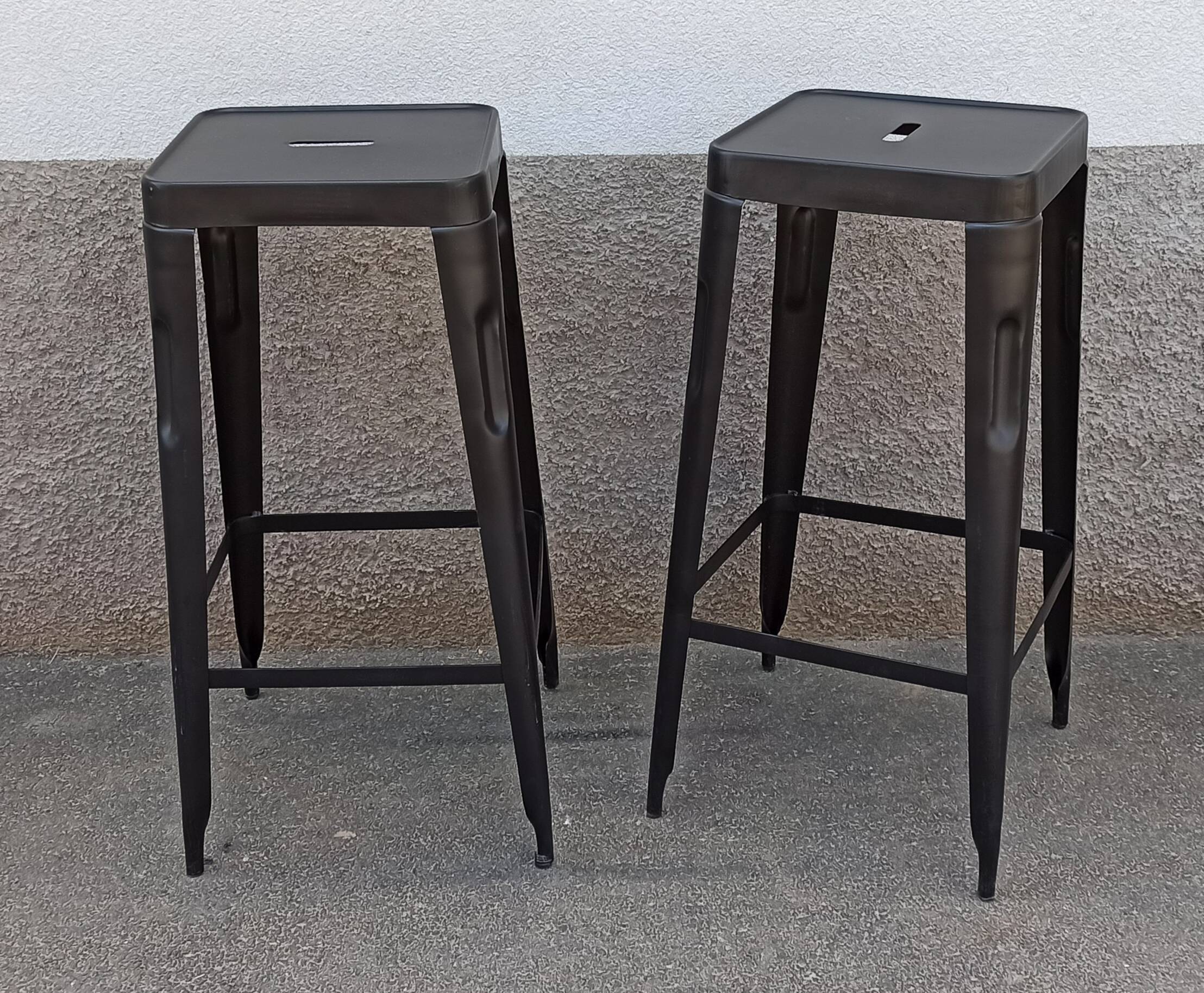 Pair of black metal stools