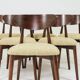 Green and walnut fabric dining chairs