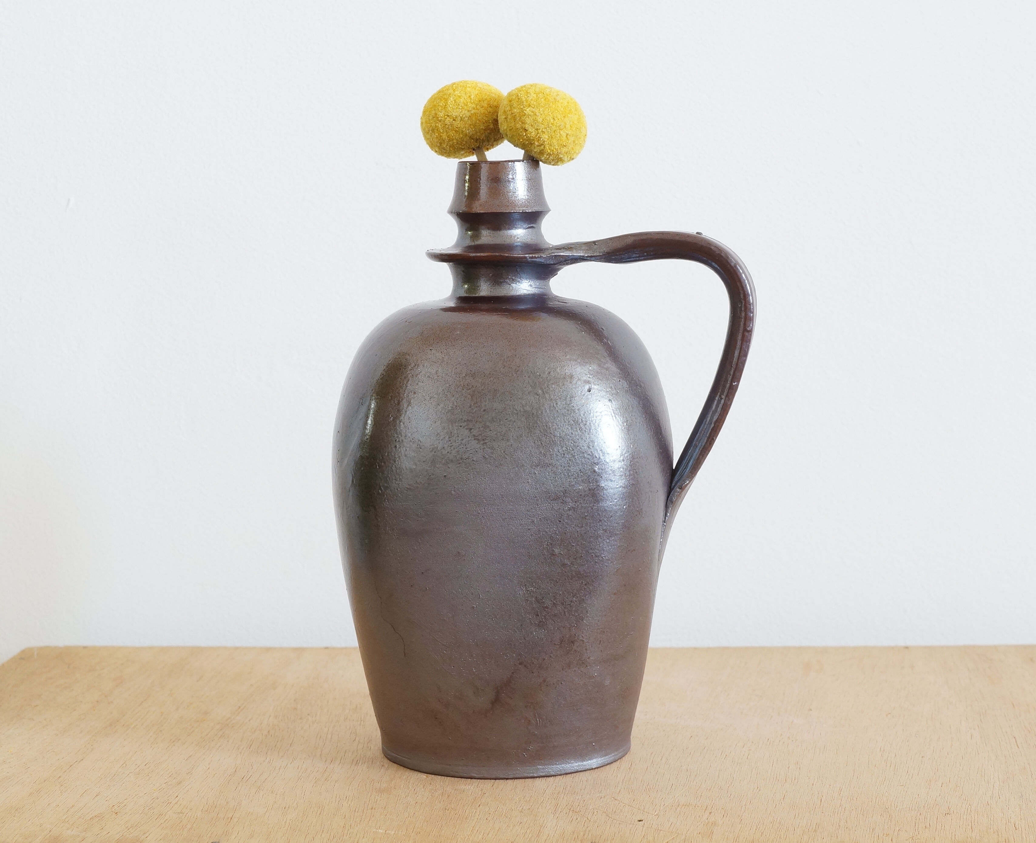 Old Norman bottle in brown ceramic