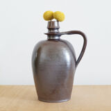 Old Norman bottle in brown ceramic