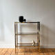 Brass and smoked glass library shelves