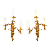 Pair of gilded bronze wall sconces in Rococo style, three lights.