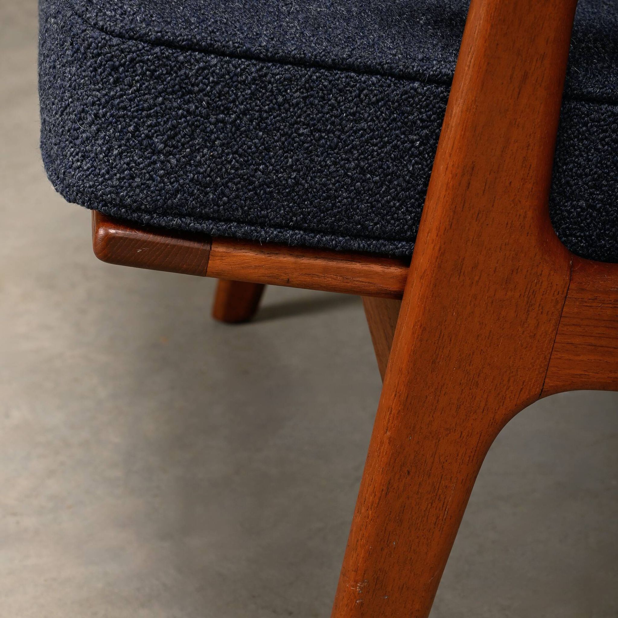 Pair Scandinavian Modern armchairs in teak and dark blue bouclé fabric