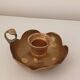 Brass candle holder in the shape of a flower.