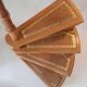Library spiral staircase in beech and brown leather.