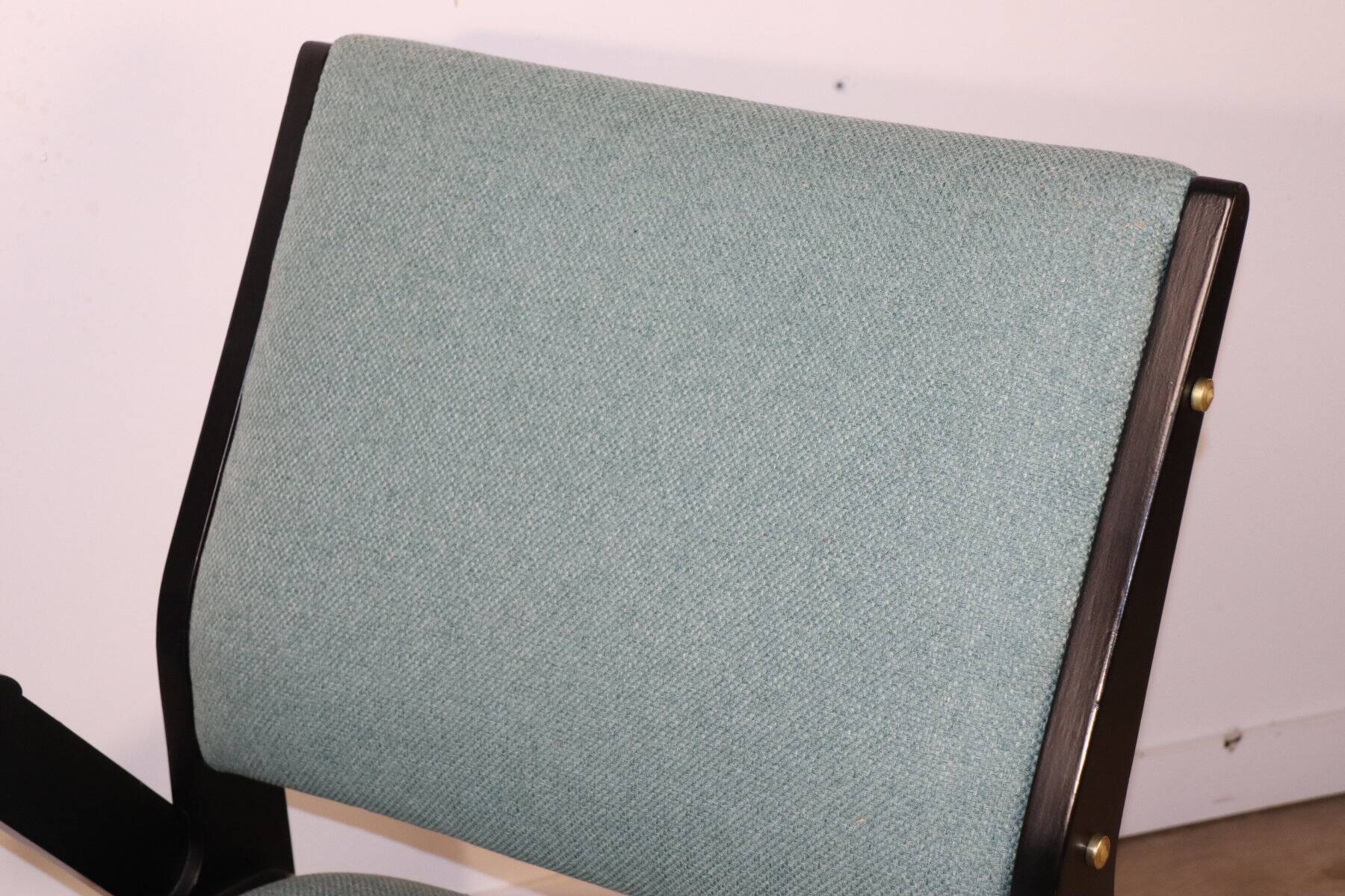 Vintage armchair from the 1960s in black wood and fabric.