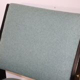 Vintage armchair from the 1960s in black wood and fabric.