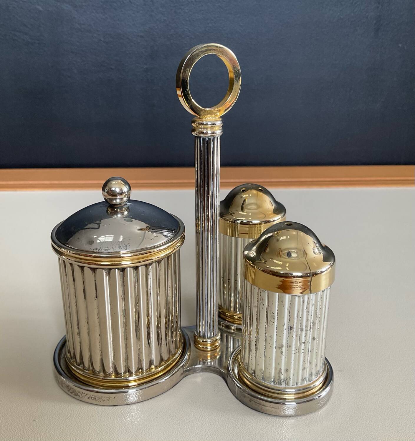 Vintage metal silver-plated and brass salt and pepper set.
