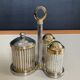 Vintage metal silver-plated and brass salt and pepper set.