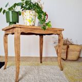 Antique coffee table with curved legs.