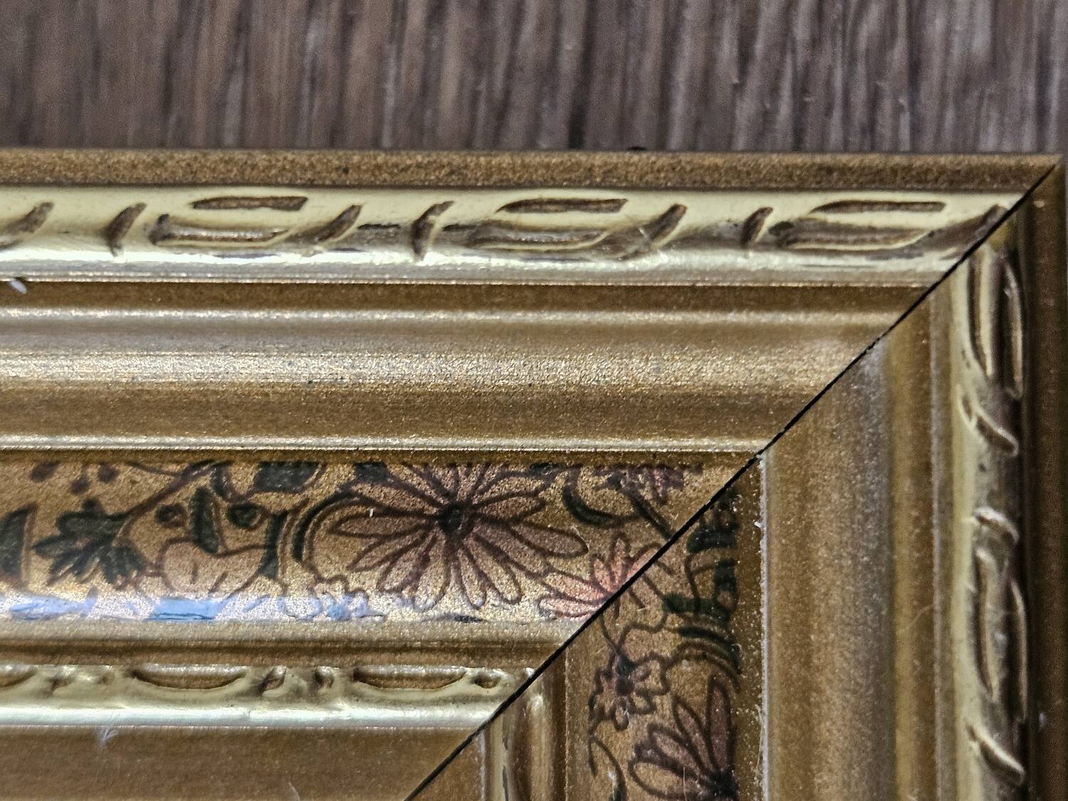 Golden frame with purple floral patterns