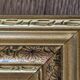 Golden frame with purple floral patterns
