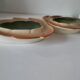 Two biomorphic bowls Salins France moss green 1950s