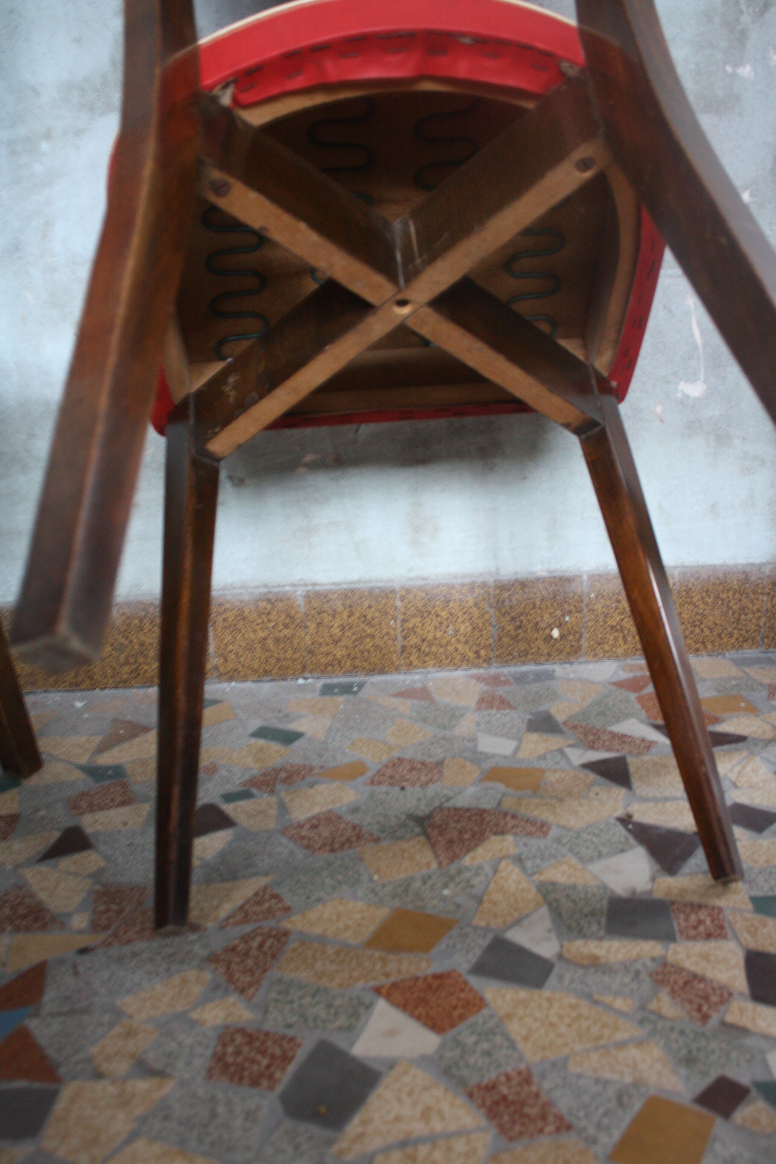 Lot of 8 vintage wooden chairs and red skai
