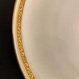 7 flat plates in porcelain of Limoges Bernardaud, decoration of golden Greek, XXth century