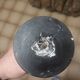 Bronze bowl on marble base